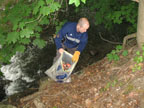 Senator Benjamin Downing cleaning the river