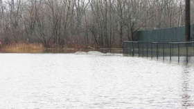 Piles of fill surrounded by water