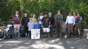 Group from one of the 2009 cleanups with pile of trash