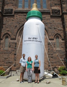 AHT staff in front of a giant baby bottle in Northampton