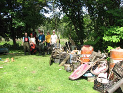 pile of trash with crew in back