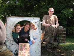 posing with treasures from the trash pile