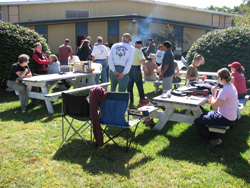 people at picnic tables having lunch