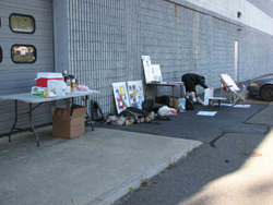table with coffee, signs, waders, etc.