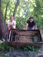 Jeff and Bruce roll refrigerator out for pickup