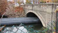 pipes coming under the bridge